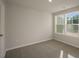 A clean bedroom with carpet, a window that lets in light, and neutral paint at 1905 Hinesley Dr, Durham, NC 27703