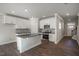 Modern kitchen with white cabinets, stainless steel appliances, and an island with bar seating at 1905 Hinesley Dr, Durham, NC 27703