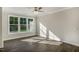 Living room with hardwood floors and large windows providing natural light at 1905 Hinesley Dr, Durham, NC 27703