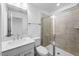 Bathroom featuring a glass enclosed shower, tile, modern fixtures and vanity with plenty of counter space at 2021 Clydner Dr, Apex, NC 27523