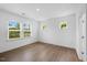 Bright bedroom with large windows and hardwood floors at 2021 Clydner Dr, Apex, NC 27523