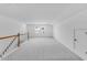 Spacious bonus room with new carpet, bright paint and natural light from windows at 2021 Clydner Dr, Apex, NC 27523