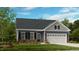 Charming single-Gathering home with a manicured lawn, attached garage and inviting front entrance at 2021 Clydner Dr, Apex, NC 27523