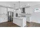 Modern kitchen featuring an island, stainless steel appliances, and ample cabinet space at 2021 Clydner Dr, Apex, NC 27523
