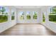 Sunroom with lots of windows and a door to the backyard at 2021 Clydner Dr, Apex, NC 27523