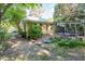 Charming backyard with a brick patio, a pergola, and a well-manicured lawn at 206 N State St, Raleigh, NC 27601