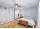 Comfortable bedroom featuring hardwood floors, ceiling fan, and access to the hallway at 206 N State St, Raleigh, NC 27601