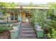 Charming home featuring a welcoming front porch with flowering vines and a decorative sun ornament at 206 N State St, Raleigh, NC 27601