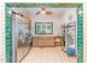 Bright kitchen with stainless steel refrigerator, tile counters, and detailed trim at 206 N State St, Raleigh, NC 27601