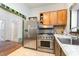 Well-equipped kitchen features stainless steel appliances, stone countertops, and tile flooring at 206 N State St, Raleigh, NC 27601