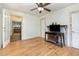 Bright living room featuring hardwood floors, ceiling fan, and doorway view to kitchen at 206 N State St, Raleigh, NC 27601