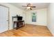 Bright living room featuring hardwood floors, ceiling fan, and great natural light at 206 N State St, Raleigh, NC 27601