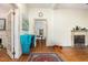 Open living room featuring hardwood floors, fireplace and doorways leading to other rooms at 206 N State St, Raleigh, NC 27601