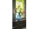Close up of a vase of flowers in a window adding a touch of elegance to the home at 206 N State St, Raleigh, NC 27601