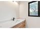 New bathroom with a modern sink and fixtures and a window view at 2205 Tampa Ave, Durham, NC 27705