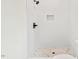 Bathroom with white tile and a tiled shower base at 2205 Tampa Ave, Durham, NC 27705