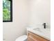 Bathroom with modern sink and fixtures and a window view at 2205 Tampa Ave, Durham, NC 27705