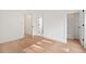 Bright bedroom featuring wood floors, and doorway access to a closet at 2205 Tampa Ave, Durham, NC 27705