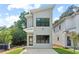 Contemporary two-story home showcasing clean lines and modern architectural design with a well-manicured lawn at 2205 Tampa Ave, Durham, NC 27705