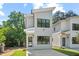 Modern two-story home with a gray facade, black-framed windows, and a well-manicured front lawn at 2205 Tampa Ave, Durham, NC 27705