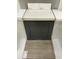 Close-up of cabinetry showing a gray finish with white countertop and light-colored vinyl flooring at 260 Meadowbark Bnd # 44, Garner, NC 27529