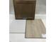Sample board displaying a cabinet door, white countertop, and a light wood-look flooring sample at 260 Meadowbark Bnd # 44, Garner, NC 27529