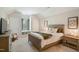 Comfortable bedroom with neutral colors, window seat, and natural light creates a relaxing and inviting atmosphere at 2601 Brookstone Ridge, Raleigh, NC 27613