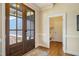 Inviting foyer with a beautiful wood door, hardwood floors, and elegant trim at 2601 Brookstone Ridge, Raleigh, NC 27613