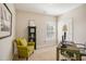 Bright home office with a window, comfortable chair, and a unique desk to promote productivity at 2601 Brookstone Ridge, Raleigh, NC 27613