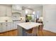 Kitchen with large island, pendant lighting, stainless appliances, and ample cabinets at 2601 Brookstone Ridge, Raleigh, NC 27613