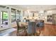 Eat-in kitchen with stainless appliances, island, and view of screened in patio at 2601 Brookstone Ridge, Raleigh, NC 27613