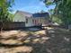 Spacious fenced backyard featuring a screened in back porch, and mature trees, providing privacy and shade at 2747 Michelle Ct, Creedmoor, NC 27522