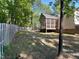 Large backyard featuring privacy fence and screened-in porch at 2747 Michelle Ct, Creedmoor, NC 27522
