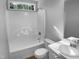 Bathroom featuring a combination tub/shower, single sink, and wood-look flooring at 2747 Michelle Ct, Creedmoor, NC 27522