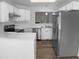 Well-appointed kitchen with stainless steel appliances, white cabinetry, and ample counter space at 2747 Michelle Ct, Creedmoor, NC 27522