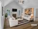 Bright living room with fireplace, vaulted ceiling, and stylish furnishings at 2747 Michelle Ct, Creedmoor, NC 27522
