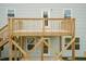 Two-story back deck with stairs and doors that lead into the house at 283 Hopewell Br Ct, Smithfield, NC 27577