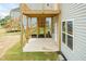 Covered back patio with a two-story deck at 283 Hopewell Br Ct, Smithfield, NC 27577