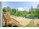 Backyard view from wood stairs highlighting the natural surroundings and partial landscaping at 283 Hopewell Br Ct, Smithfield, NC 27577