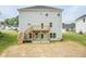 View of the backyard featuring a wooden deck with stairs and the exterior of the house at 283 Hopewell Br Ct, Smithfield, NC 27577