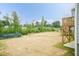 View from the backyard wood stairs highlighting partial landscaping with a chain link fence at 283 Hopewell Br Ct, Smithfield, NC 27577