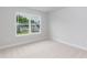 Bright bedroom with a large window that offers scenic neighborhood views at 283 Hopewell Br Ct, Smithfield, NC 27577