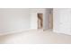 Spacious carpeted bedroom with multiple doors leading to other areas of the home at 283 Hopewell Br Ct, Smithfield, NC 27577