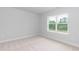 Bright bedroom with a large window offering natural light and scenic views at 283 Hopewell Br Ct, Smithfield, NC 27577