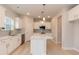 Bright kitchen with quartz countertops, white cabinetry, island, and stainless appliances at 283 Hopewell Br Ct, Smithfield, NC 27577