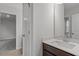 This bathroom has a clean white sink and wood cabinets with a mirror at 3008 Dog Rose Dr # 307, Durham, NC 27703