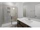 Bathroom features a shower with a glass door, stone tile, and a quartz countertop at 3008 Dog Rose Dr # 307, Durham, NC 27703