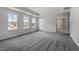 Bright bedroom boasts plush carpeting, natural light, and an access door to the outside deck at 3008 Dog Rose Dr # 307, Durham, NC 27703