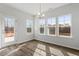 Sun-filled breakfast nook featuring large windows and a glass panel entry door at 3008 Dog Rose Dr # 307, Durham, NC 27703