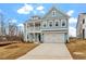 Charming two-story home with a balcony, blue siding, and a long driveway at 3008 Dog Rose Dr # 307, Durham, NC 27703